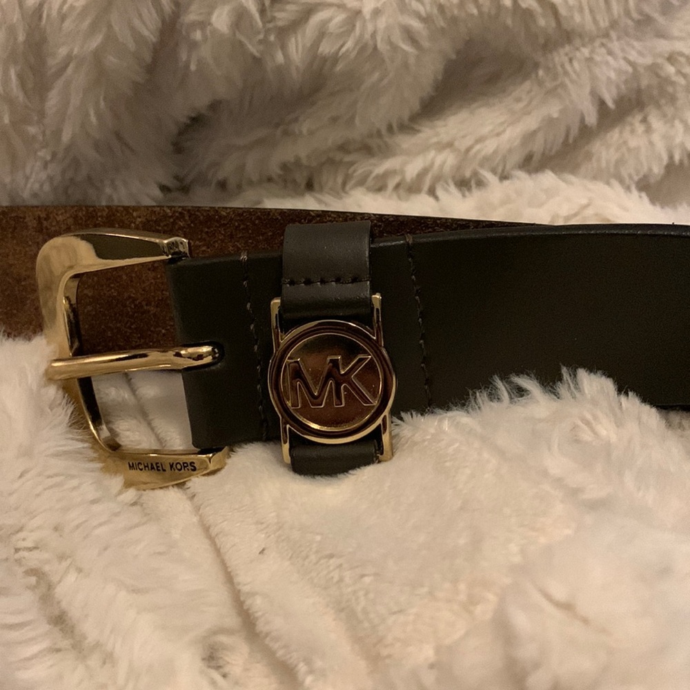 Brown women’s leather Michael Kors size L, 42 inches, belt.